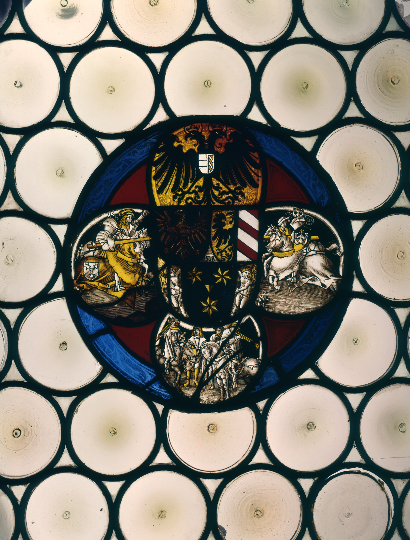 Medieval stained glass roundel with heraldic imagery